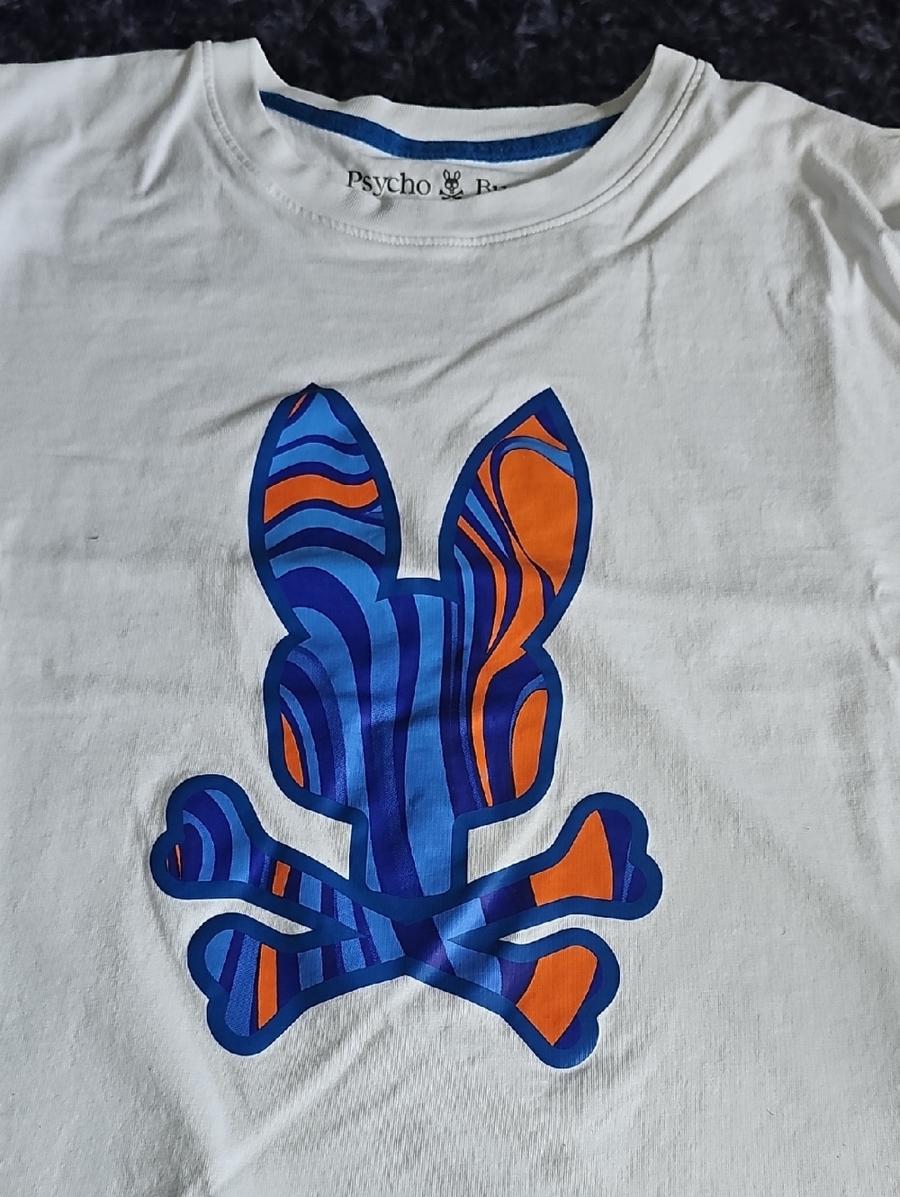 Psycho Bunny Kids White Tee with Blue & Orange Swirl Logo